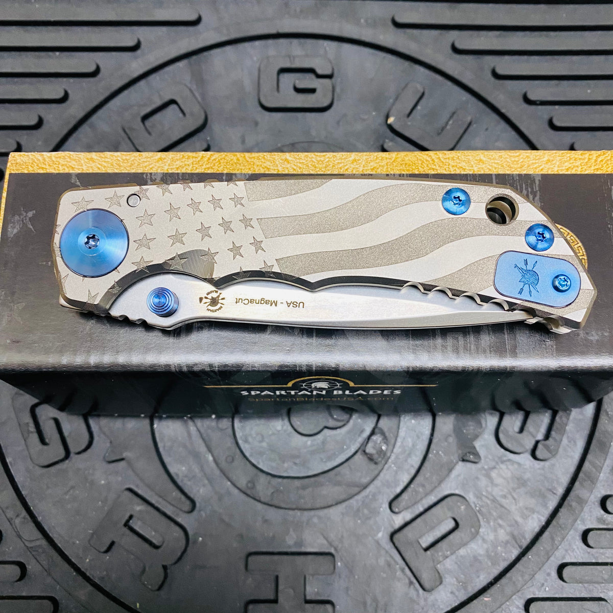 Spartan Blades Harsey Folder - Gray American Waving Flag Satin Magnacut Blade, Blue ANO Hardware Knife
